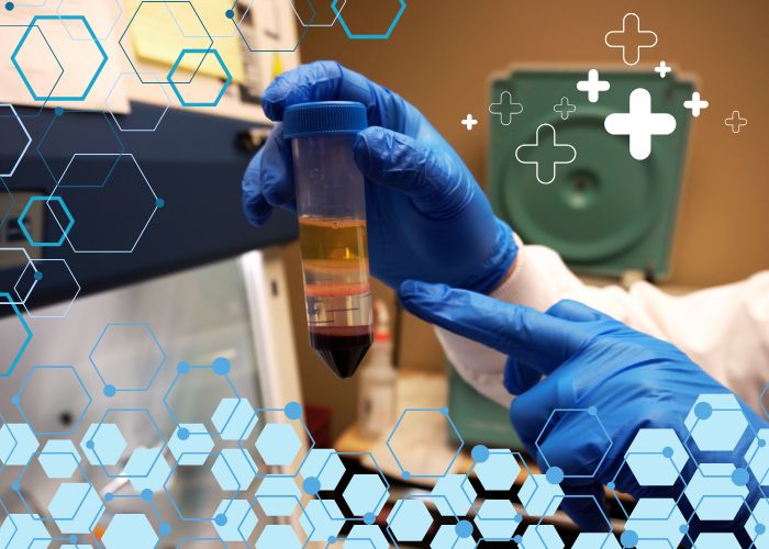 Team member holding a lab sample